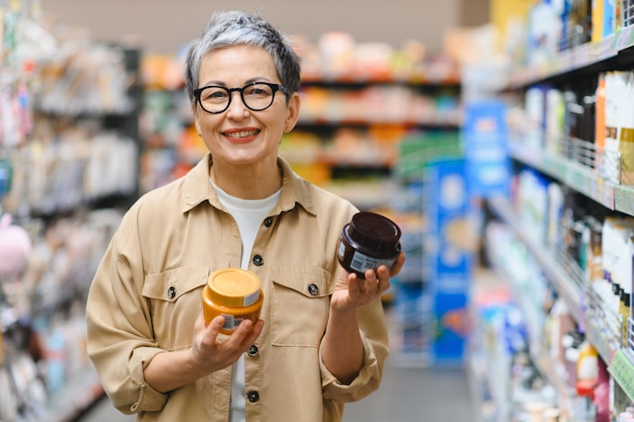 Mature Beauty Shopper In Store Adobe Stock 1874708014