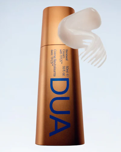 Bronze cylindrical skincare product bottle with blue DUA branding