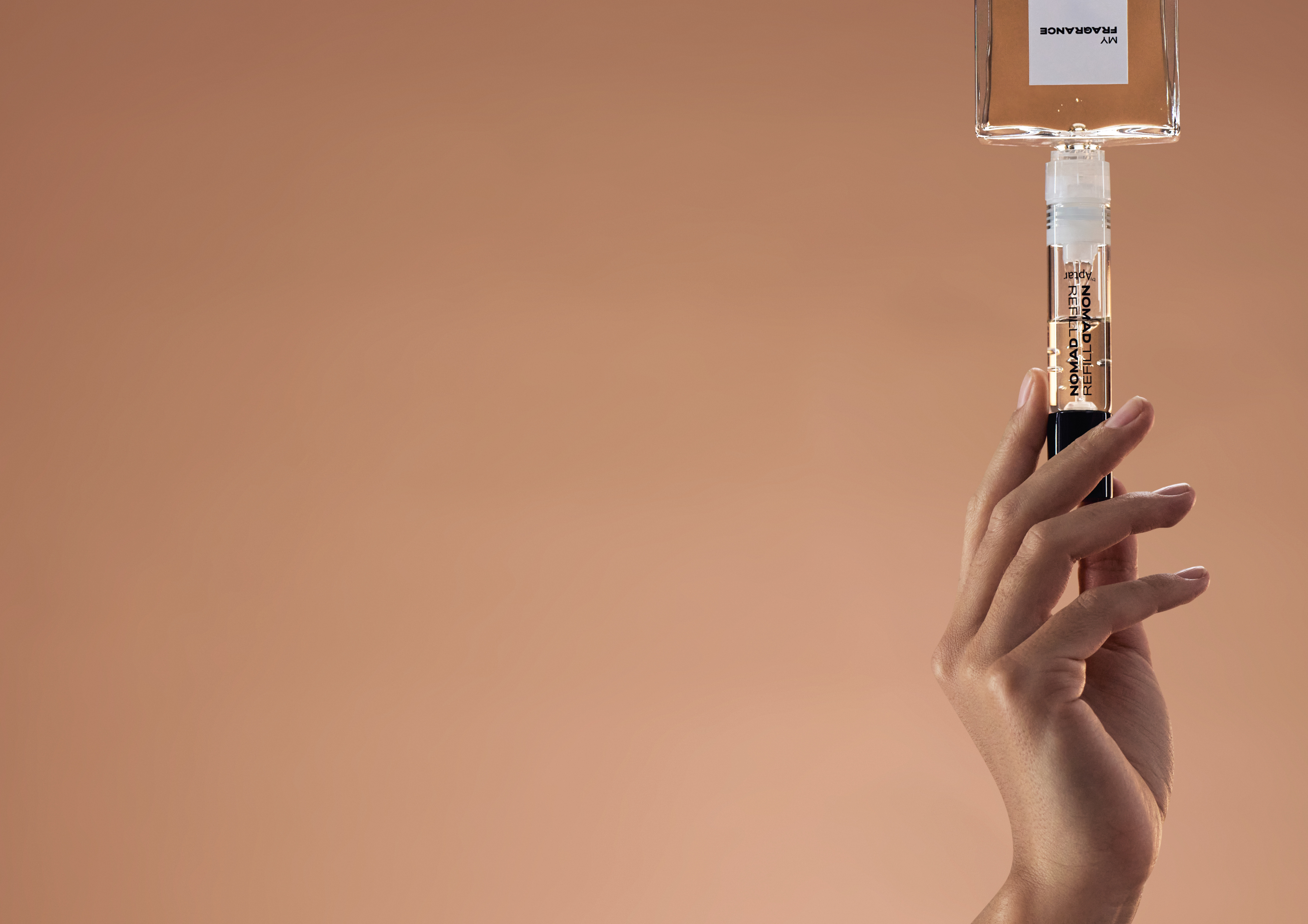 The headline launch is Nomad Refill, a 10 ml purse spray that connects directly to standard fragrance bottles for a sub-five-second refill&mdash;no funnel, no pumping&mdash;built around a universal connector to simplify at-home refill rituals.