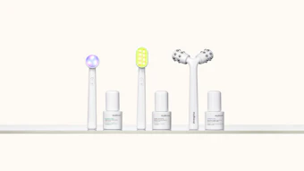 Nuface skincare device collection with three LED-light therapy wands and matching serums displayed in a row