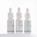 Three white dropper bottles of Lira Clinical Smart Boosters serums with teal accents, labeled PDRN+, TXA+, and NAD+