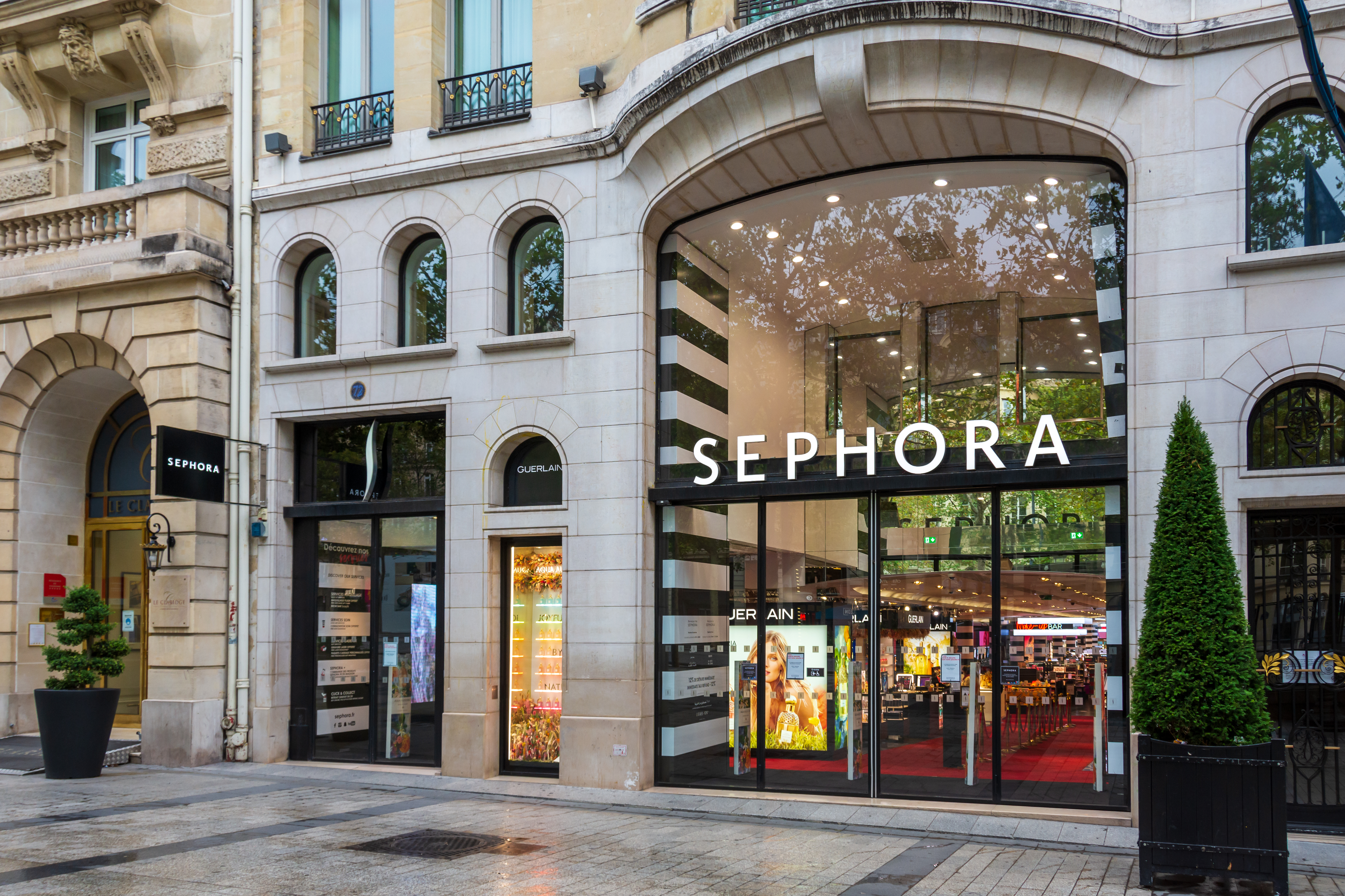 Sephora beauty store storefront with striped awning on Parisian street corner