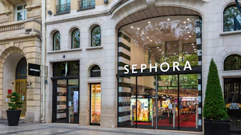 Sephora beauty store storefront with striped awning on Parisian street corner