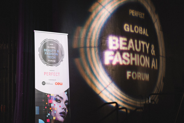 Global Beauty & Fashion AI Forum event signage with illuminated circular display and promotional banner at venue